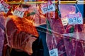 Window display of a British butcher showing various types of meat and their prices, London, UK Royalty Free Stock Photo