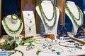 Window display of green jewellery