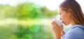 Window, drinking coffee and woman thinking, relax and daydreaming for happiness, chilling and on break. Glass, female Royalty Free Stock Photo