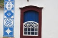 Window on the facade of an old and elegant colonial townhouse