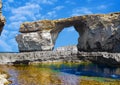 Window, famous stone arch of Gozo island in the sun in summer, Malta Royalty Free Stock Photo