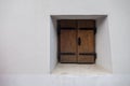Window on the faÃÂ§ade of a stone wall Royalty Free Stock Photo