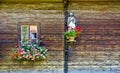 Window with flower decoration and figure of a saint