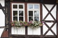 Window with flowers on a half-timbered house,