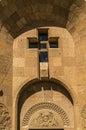 Window in the form of a cross on the facade of the Church of the Holy Martyrs in the village of Teghenik of Armenia