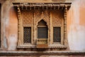 window frame with intricate carvings, bringing historial and cultural value to a space