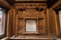 window frame with intricate carvings, bringing historial and cultural value to a space