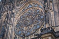 The window on the front of the gothic Vysehrad cathedral in Prague featuring beautiful windows and stone wall and pillars