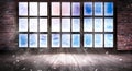 The window is frozen, frosty morning, snowflakes on the glass, an empty room with a window, an old brick wall and a wooden floor.