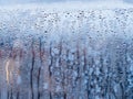 Window glass close-up, showing severe water droplet condensation. Royalty Free Stock Photo