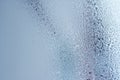 Window glass with condensation, strong, high humidity in the room, large water droplets flow down the , cold tone Royalty Free Stock Photo