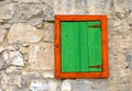 Window with green shutter on a stone wall Royalty Free Stock Photo