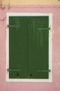 Window with green shutters closed Royalty Free Stock Photo