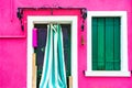 Window with green shutters and door on the pink wall Royalty Free Stock Photo