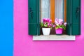Window with green shutters on the pink wall Royalty Free Stock Photo