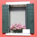 Window with green wooden shutters Royalty Free Stock Photo