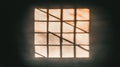 A window with a grid pattern and sunlight shining through. Royalty Free Stock Photo
