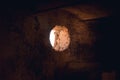 Window hole light sun wall old ruin basement Royalty Free Stock Photo