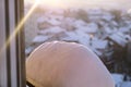 Window of home covered with big snow layer in winter, view from inside, close up. Detail of snowdrift, snow texture. Royalty Free Stock Photo