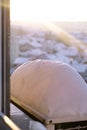 Window of home covered with big snow layer in winter, view from inside, close up. Detail of snowdrift, snow texture. Royalty Free Stock Photo