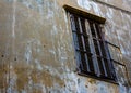 window and house facade with bullet holes Royalty Free Stock Photo