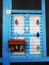 Window of a house with a mailbox for the mail of Tan Jetty, the floating town of Georgetown, Malaysia