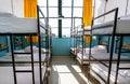 Window of house with many bunk beds. Light bedroom with clean sheets Royalty Free Stock Photo