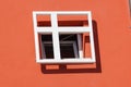 Window with iron grating on stone wall