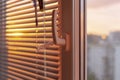 Evening sun light outside window blinds, sunshine and shadow on window Royalty Free Stock Photo