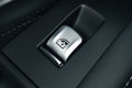 Window lifter button in a luxury car Royalty Free Stock Photo