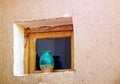 A traditional clay made window vase in desert