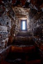 Window loophole in the old castle. Gun loophole in the brick wall of the fortification Royalty Free Stock Photo