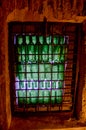 Window of green wine bottles in a wine cellar Royalty Free Stock Photo