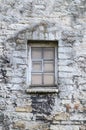 Window in medieval limestone wall