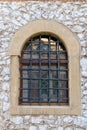 window with a medieval-style grille Royalty Free Stock Photo