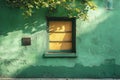 Window with metal bars in old green wall of house. Green facade of house and tree branches are visible from above Royalty Free Stock Photo
