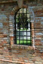 Window with metal grating and brick wall Royalty Free Stock Photo