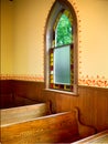 Window next to pews in Simple old Church