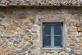 Window of old abandoned and dilapidated stone house in the Tuscan countryside in Italy Royalty Free Stock Photo