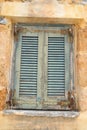 Window of an old apartment building in Malia. Royalty Free Stock Photo