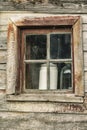 Window of an old farm building. Natural vintage dirty texture. Specially preserved rural wooden house for agriturism Royalty Free Stock Photo