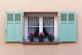 Window in an old house decorated with flower pots Royalty Free Stock Photo