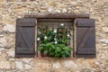 Window in an old house decorated and flowers Royalty Free Stock Photo