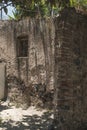 Window of an old house in a wall of adobes and quarry Royalty Free Stock Photo