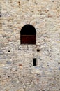 Window in old stone wall of medieval castle Royalty Free Stock Photo