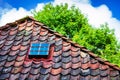 Window on old tile roof Royalty Free Stock Photo