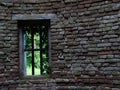 Window in an old wall of the folly fake ruin Royalty Free Stock Photo