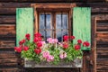 Window of an old wooden cabin in the alps Royalty Free Stock Photo