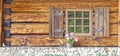 Window of an old wooden cottage. Royalty Free Stock Photo