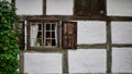 A window with open shutters on a white wall Royalty Free Stock Photo